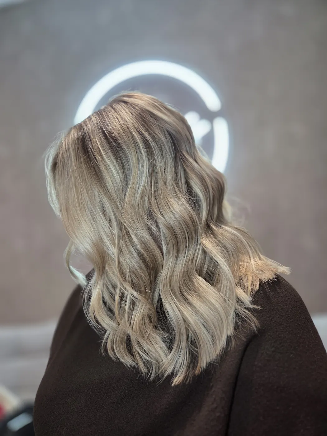 Beautiful blonde waves styled at Chalmers Hair Harrogate